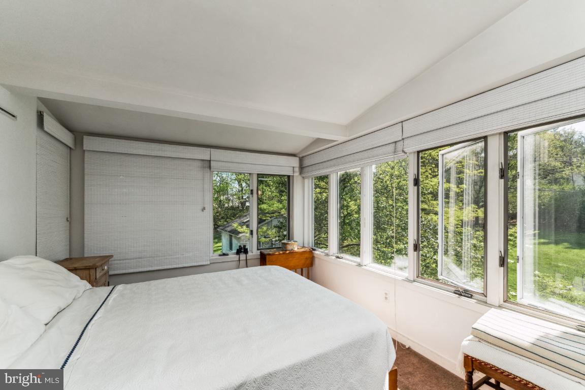 1807 Kenway Road Baltimore, MD 21209 - Photo 19 of 54 a bedroom with a large bed and a large window