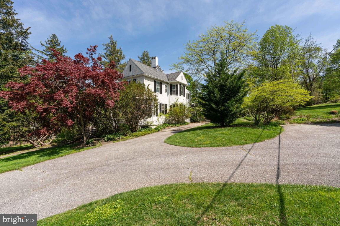 1807 Kenway Road Baltimore, MD 21209 - Photo 2 of 54 a view of a street with a houses in the background