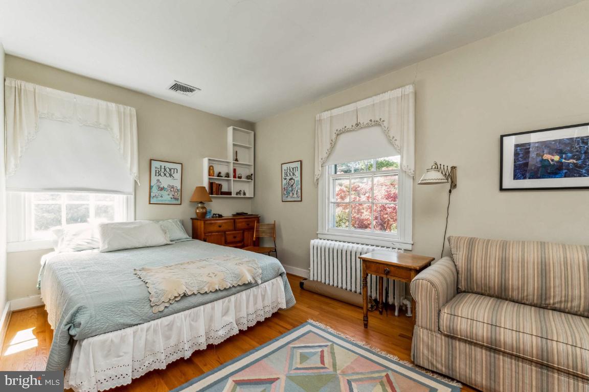 1807 Kenway Road Baltimore, MD 21209 - Photo 26 of 54 a bedroom with a bed and a couch