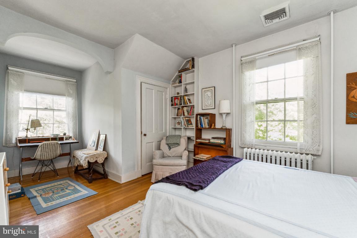 1807 Kenway Road Baltimore, MD 21209 - Photo 27 of 54 a bedroom with a bed a large window and book shelf