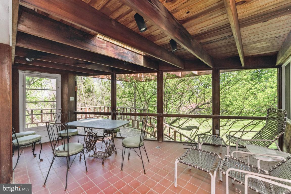 1807 Kenway Road Baltimore, MD 21209 - Photo 29 of 54 a view of a dining room with furniture window and outside view