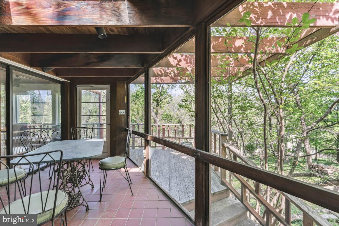 1807 Kenway Road Baltimore, MD 21209 - Photo 30 of 54 a living room with large windows and furniture
