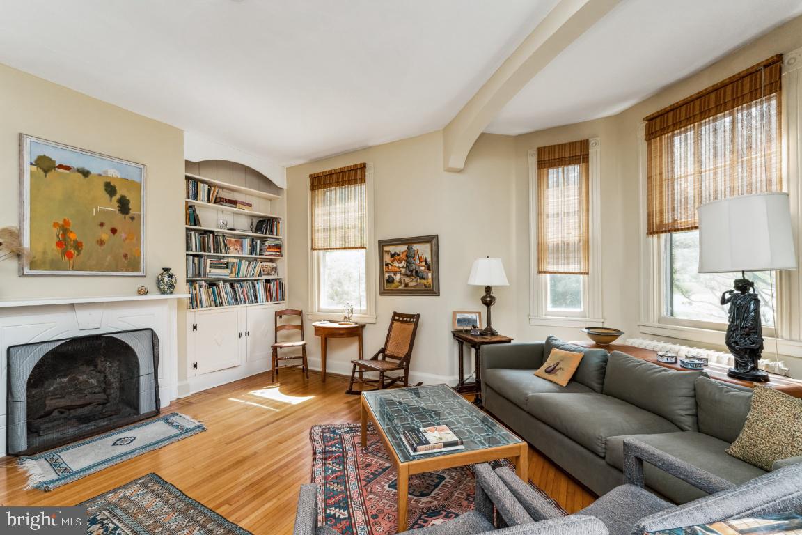 1807 Kenway Road Baltimore, MD 21209 - Photo 8 of 54 a living room with furniture a fireplace and a large window