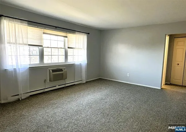 an empty room with a fireplace