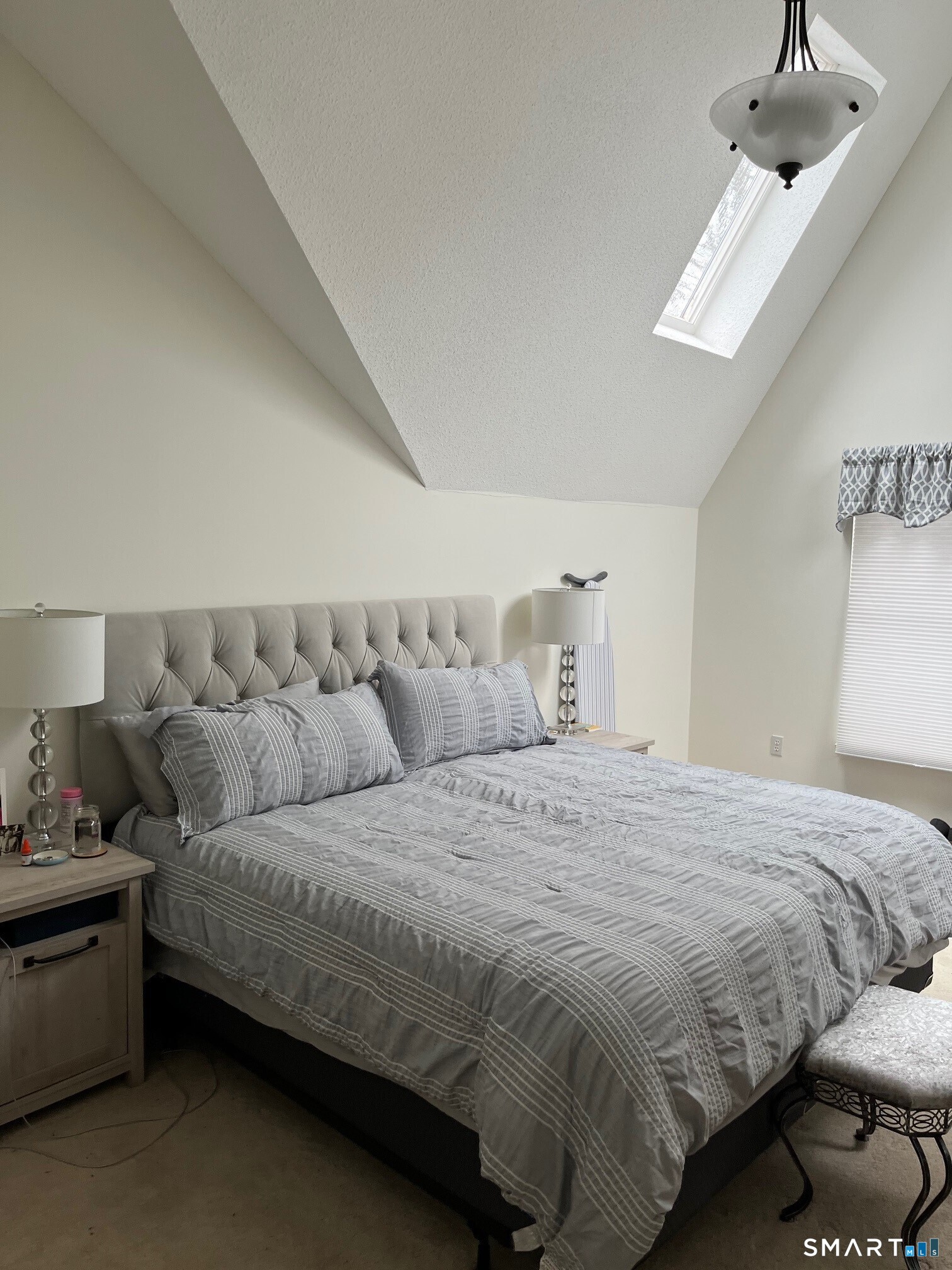 6 Timberline Drive, Unit 6 Farmington, CT 06032 - Photo 18 of 26 a bedroom with a bed and a couch