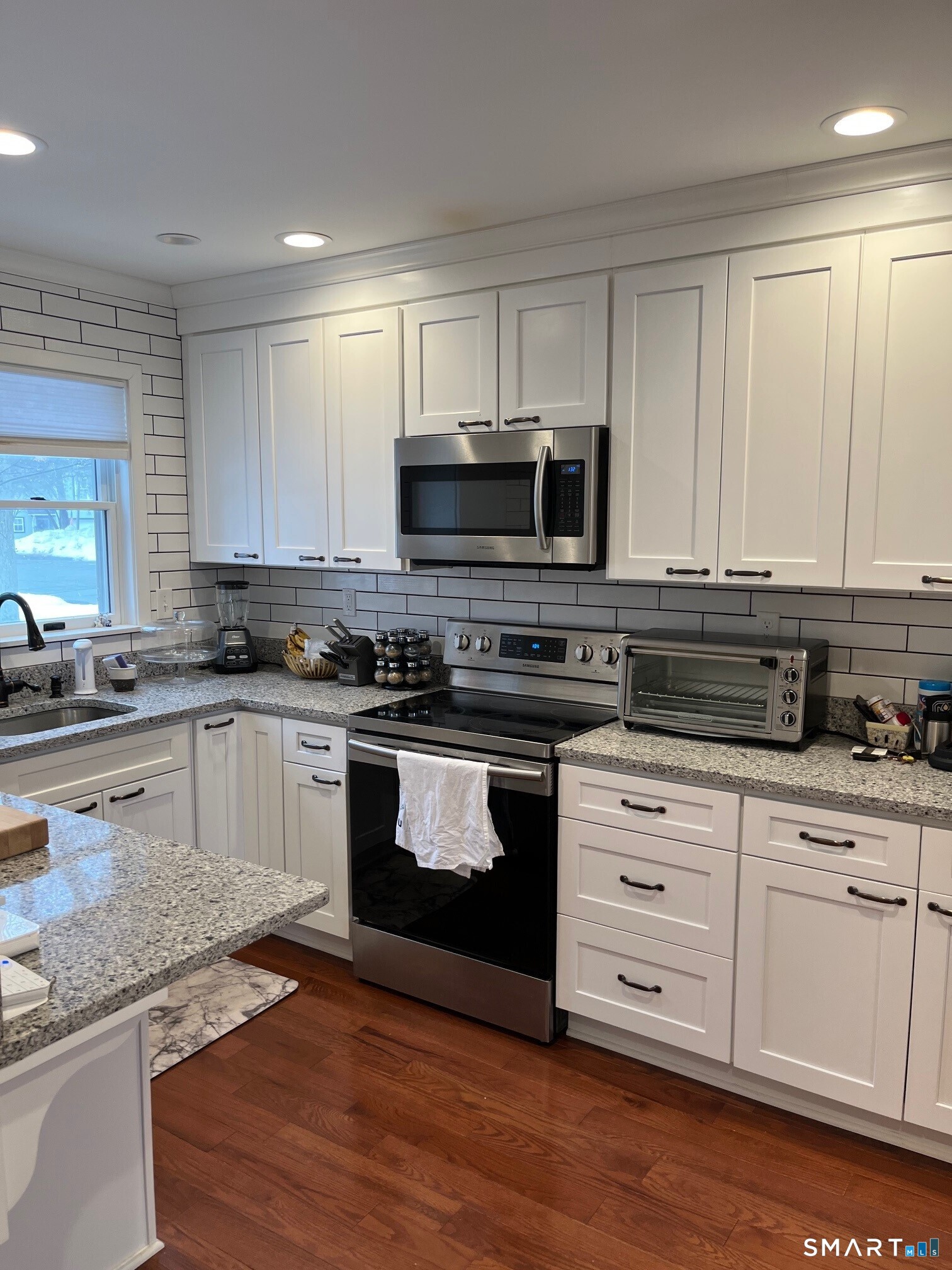 6 Timberline Drive, Unit 6 Farmington, CT 06032 - Photo 2 of 26 a kitchen with granite countertop a sink cabinets and stainless steel appliances
