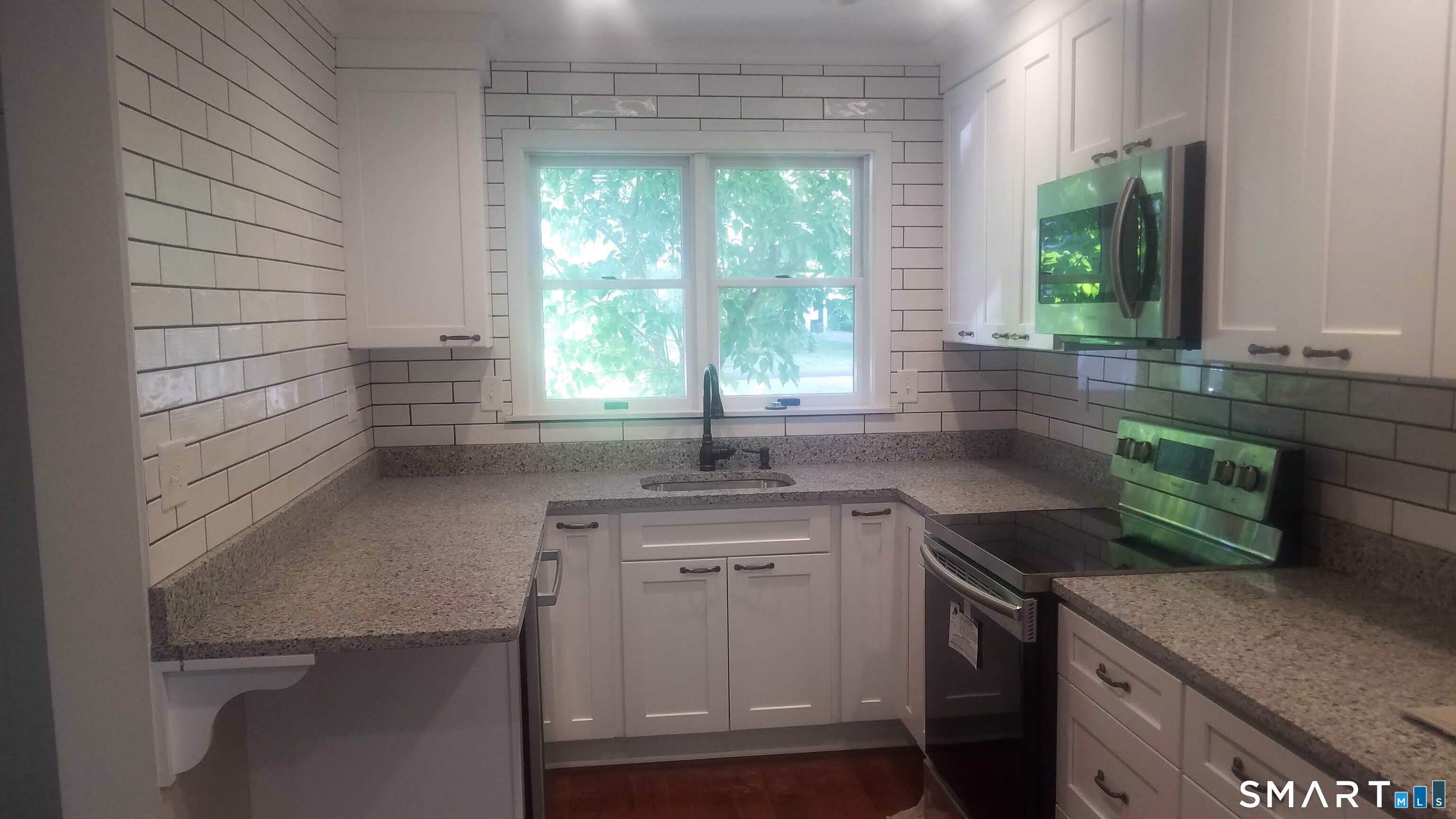 6 Timberline Drive, Unit 6 Farmington, CT 06032 - Photo 3 of 26 a kitchen with a sink and a window