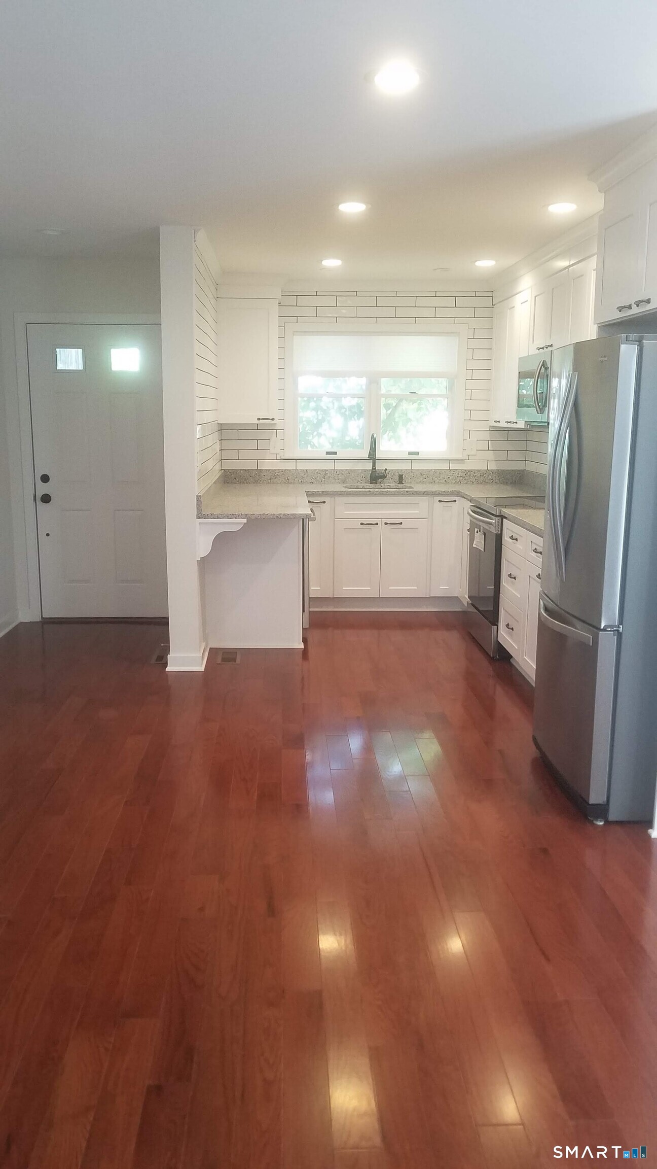 6 Timberline Drive, Unit 6 Farmington, CT 06032 - Photo 5 of 26 a view of kitchen with refrigerator stove and cabinets