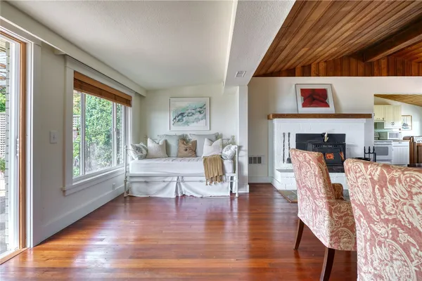 a living room with fireplace furniture and a fireplace