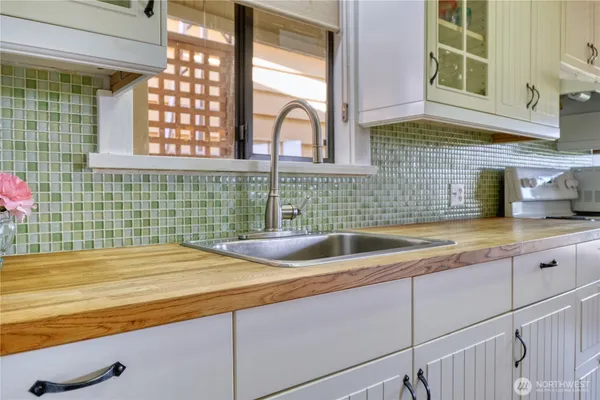 a kitchen with a sink and a window