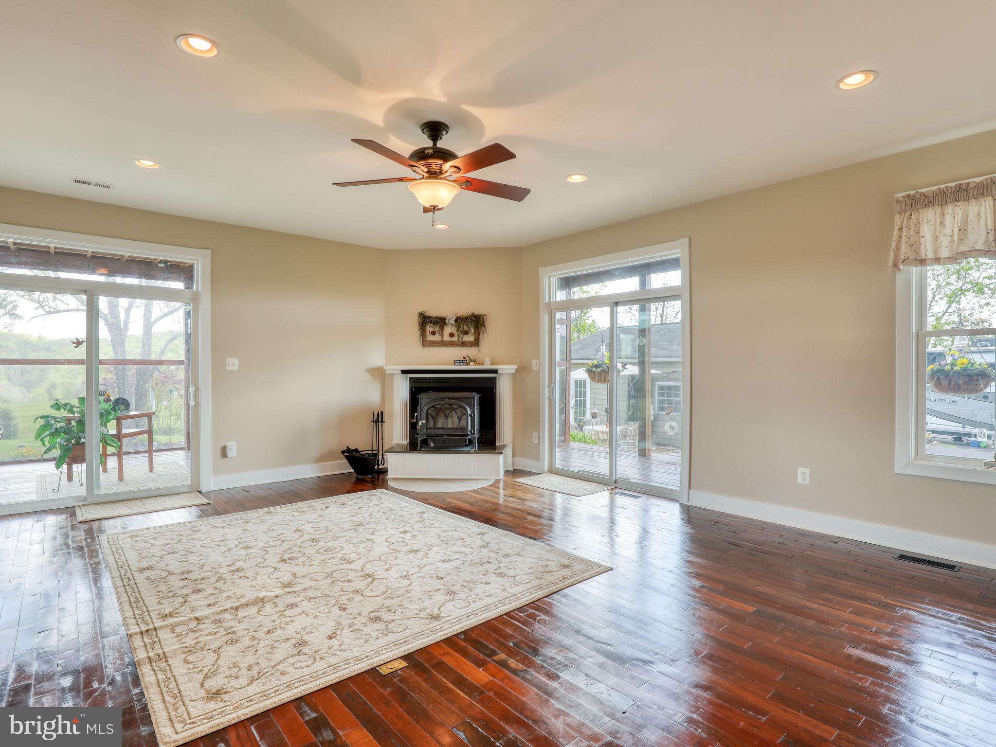 902 Forest Grove Road Middletown, VA 22645 - Photo 49 of 84 The living room has two sets of sliders