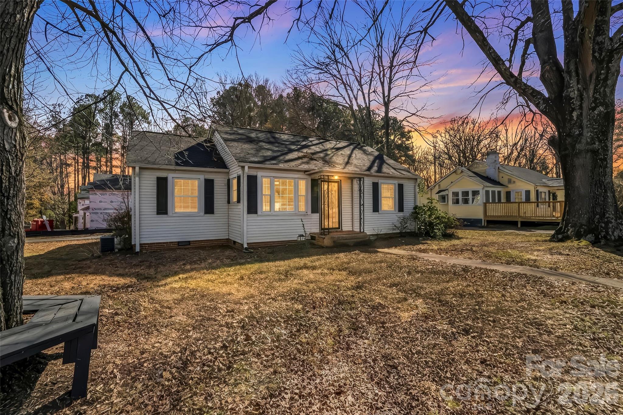 1072 5th Street Northeast Hickory, NC 28601 - Photo 1 of 33 a view of a yard with a house and a tree