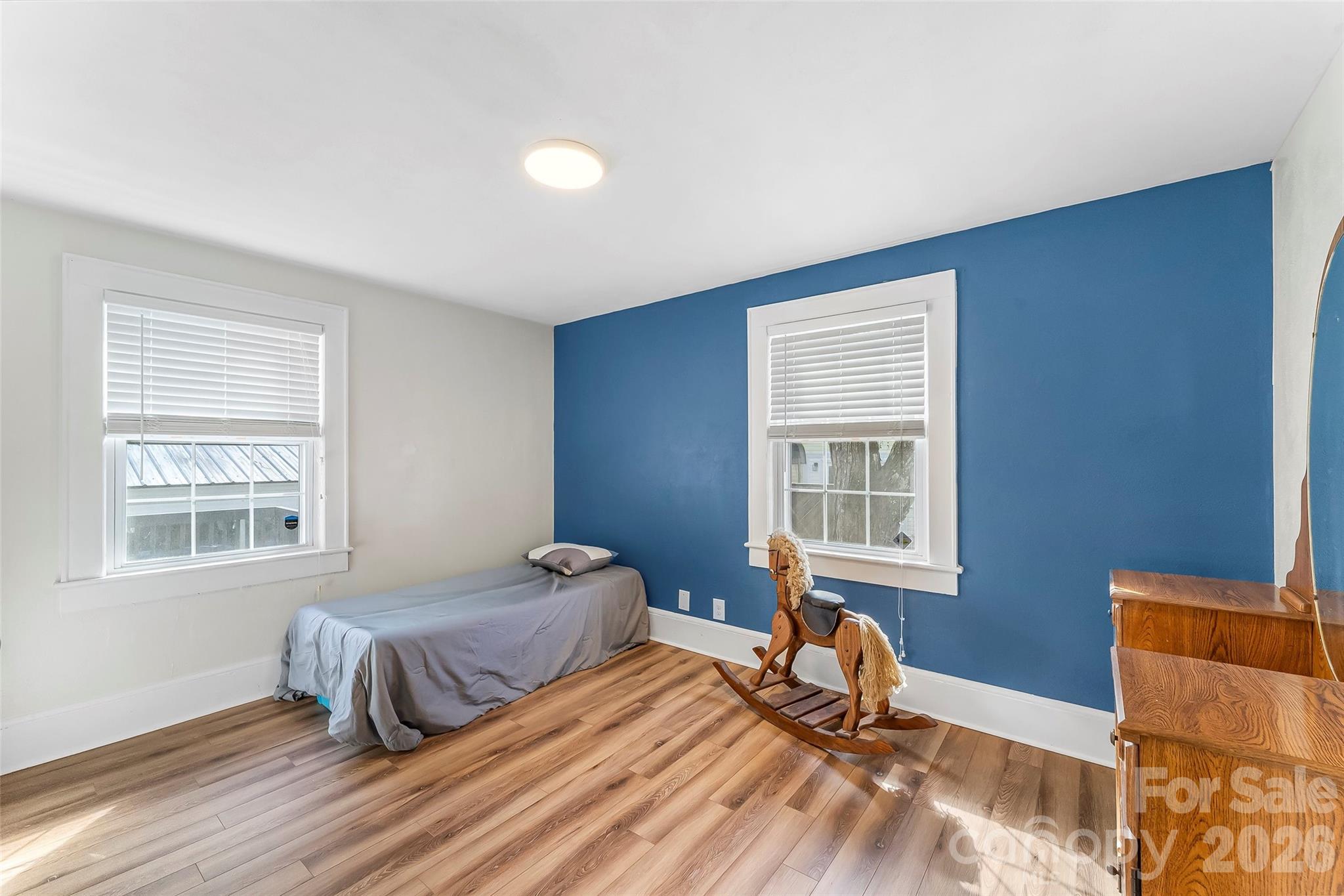 1072 5th Street Northeast Hickory, NC 28601 - Photo 13 of 33 a bedroom with two beds and a window