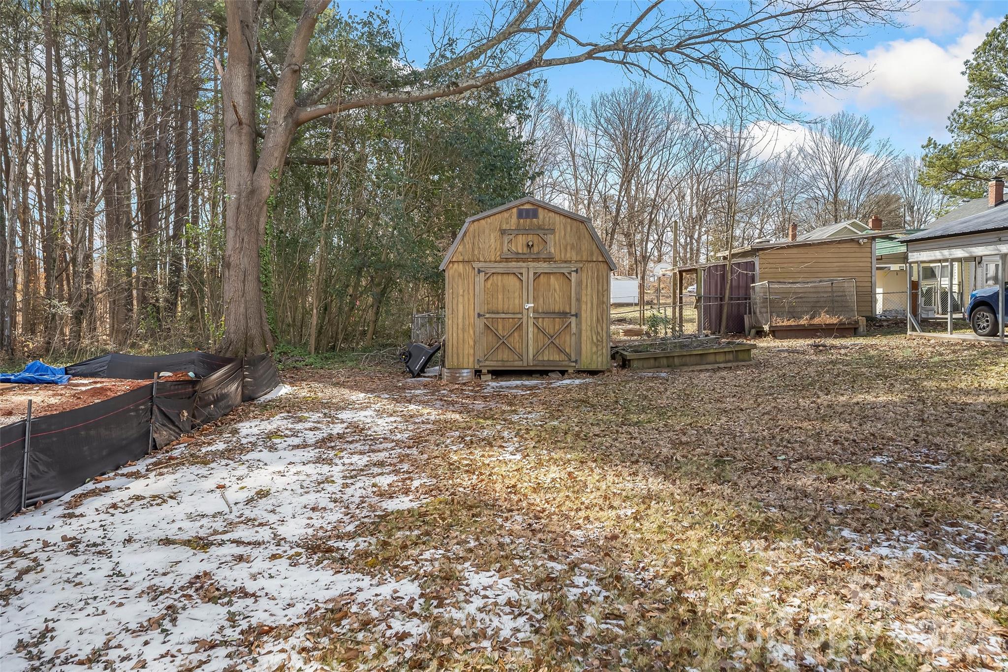 1072 5th Street Northeast Hickory, NC 28601 - Photo 21 of 33 a backyard of a house with yard and outdoor seating