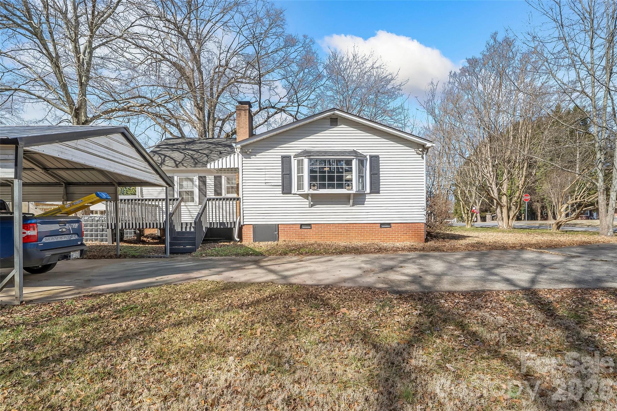 1072 5th Street Northeast Hickory, NC 28601 - Photo 22 of 33 a view of a house with a yard covered in snow