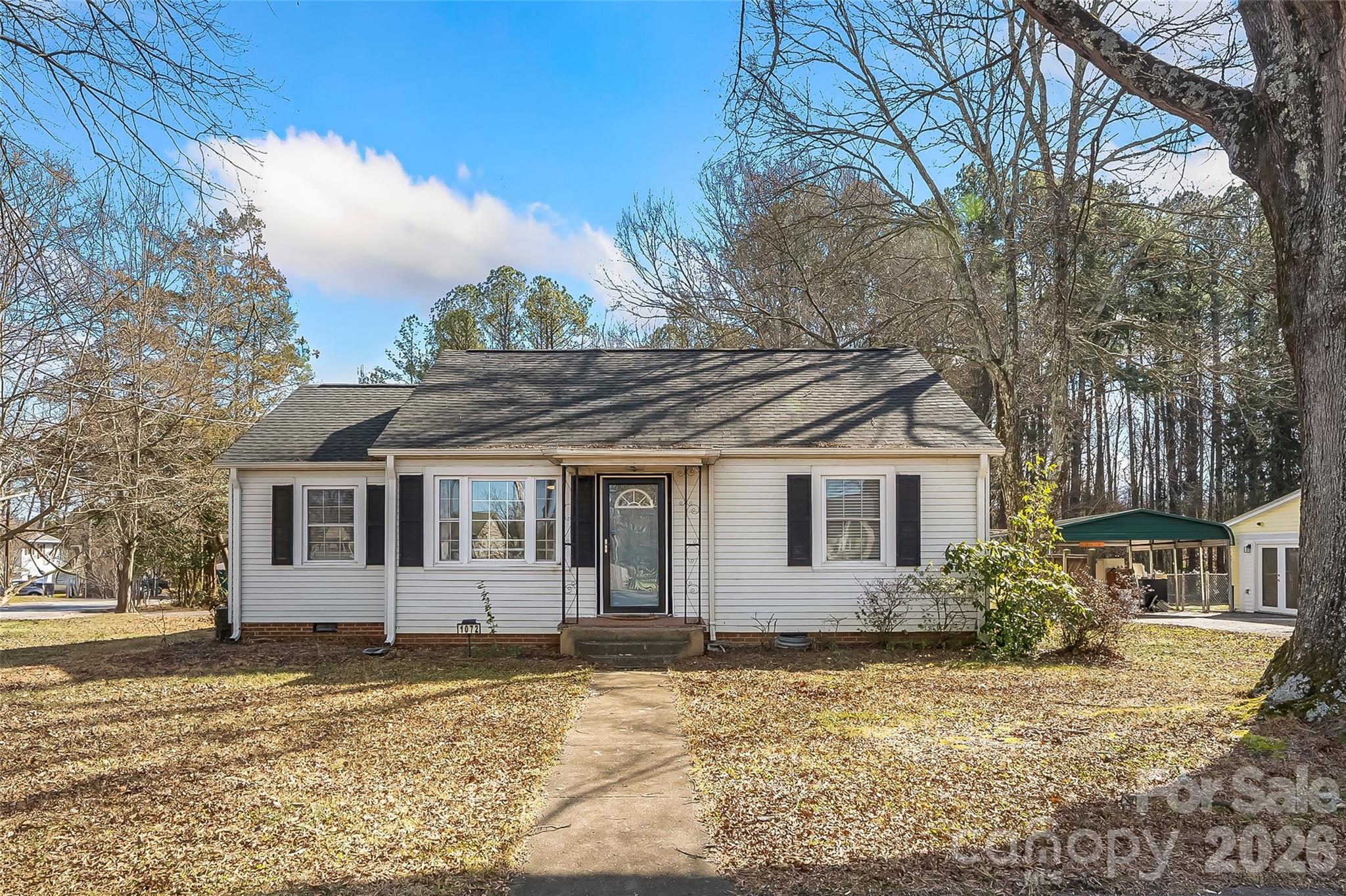 1072 5th Street Northeast Hickory, NC 28601 - Photo 33 of 33 a front view of a house with a yard