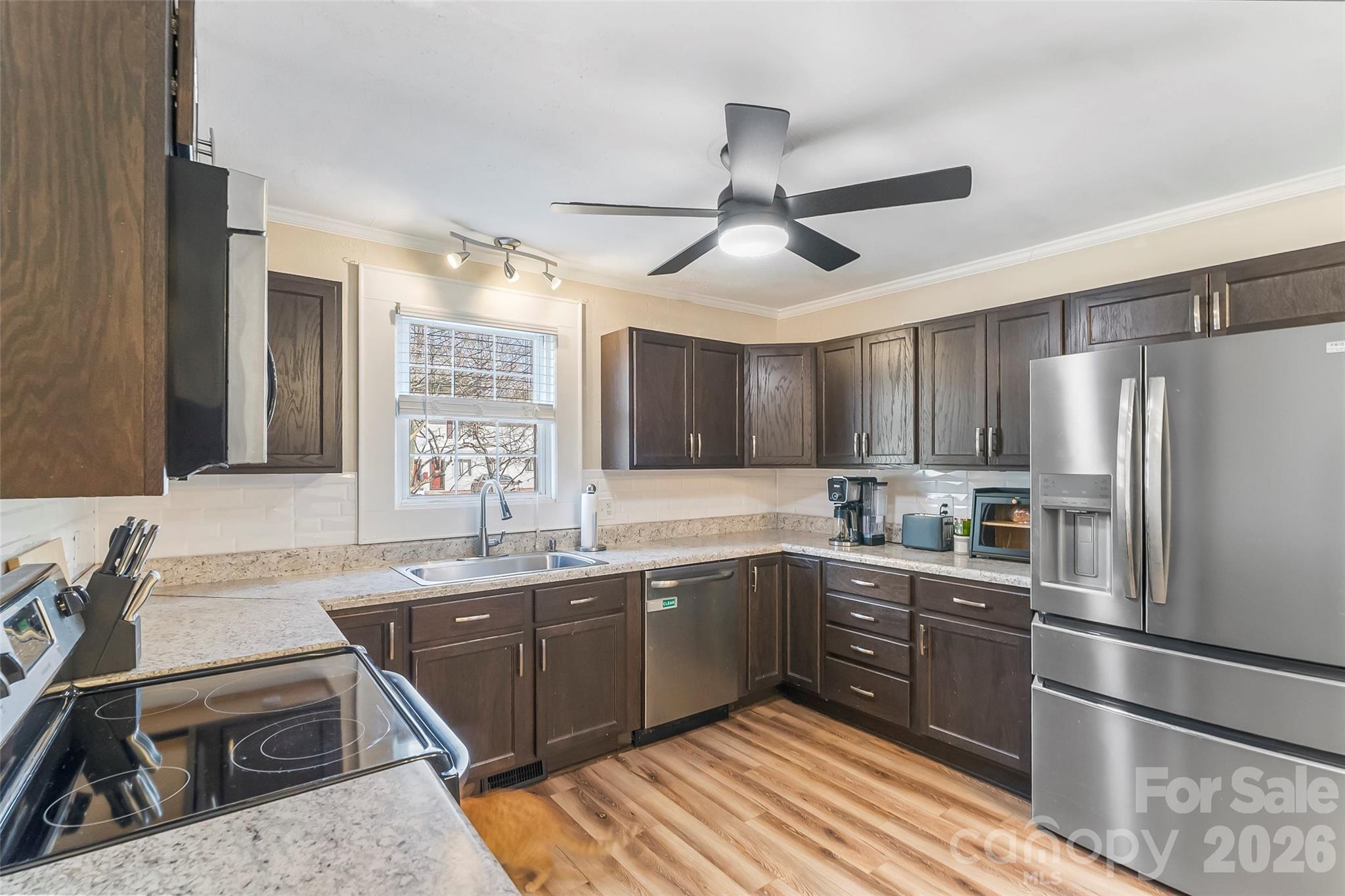 1072 5th Street Northeast Hickory, NC 28601 - Photo 4 of 33 a kitchen with stainless steel appliances granite countertop a sink stove and refrigerator