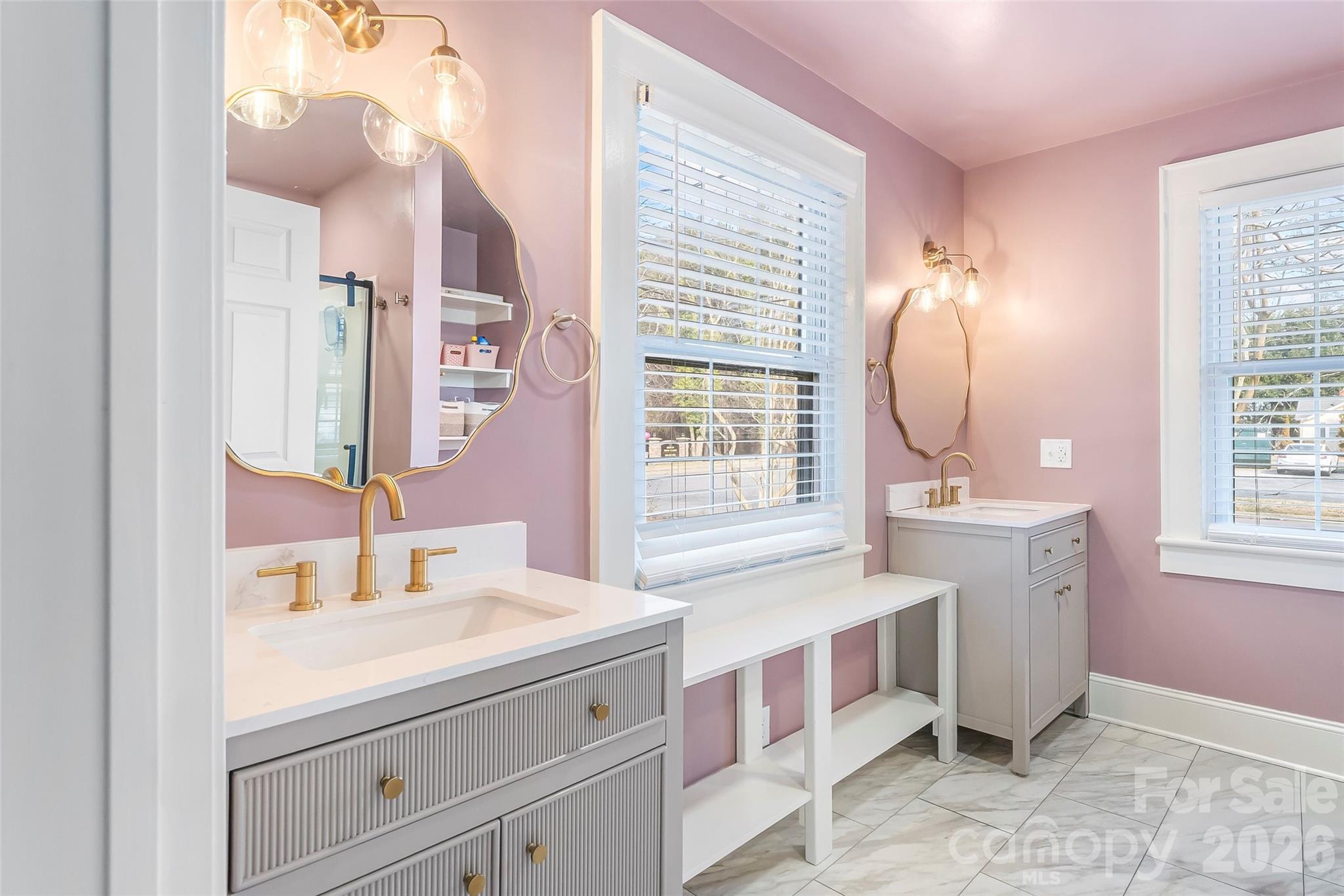 1072 5th Street Northeast Hickory, NC 28601 - Photo 9 of 33 a bathroom with a sink a vanity and a mirror