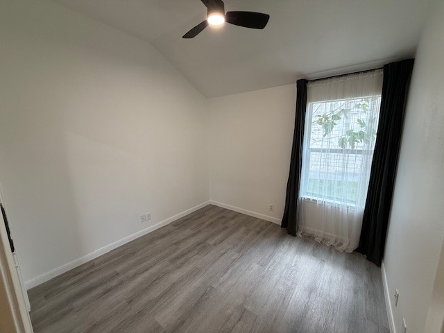 1121 Wigwam Leander, TX 78641 - Photo 13 of 18 an empty room with wooden floor and windows