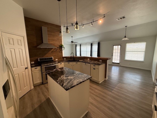 1121 Wigwam Leander, TX 78641 - Photo 18 of 18 a kitchen with a refrigerator a sink and wooden floor