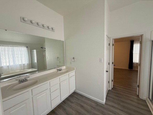 1121 Wigwam Leander, TX 78641 - Photo 9 of 18 a bathroom with a double vanity sink and mirror