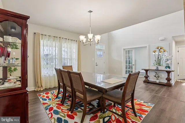a view of a dining room with furniture and window