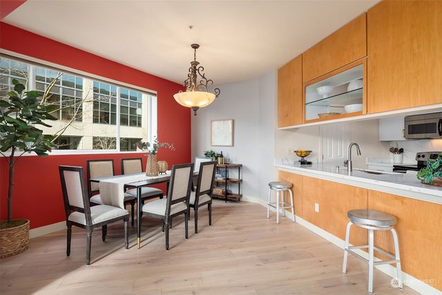 a view of a dining room with furniture window and wooden floor