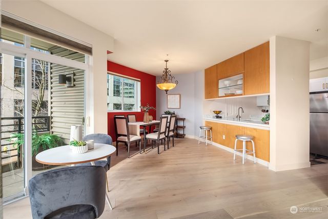 a living room with furniture and a sink