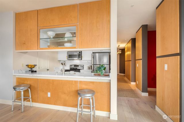 a kitchen with a sink and a refrigerator