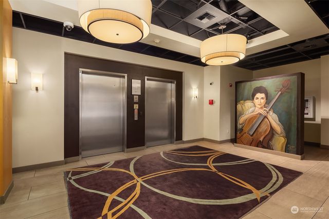 a room with gym equipment and a mirror