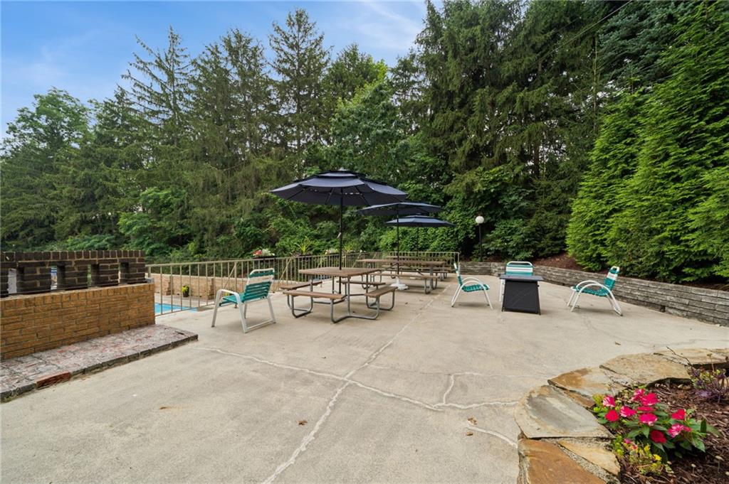 53 Highland Road, Unit 403404 Bethel Park, PA 15102 - Photo 30 of 33 a view of backyard with outdoor seating and trees