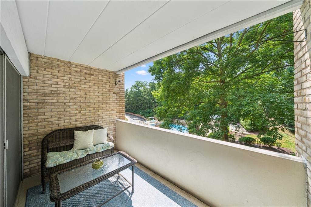 53 Highland Road, Unit 403404 Bethel Park, PA 15102 - Photo 6 of 33 a balcony with a bench and potted plants