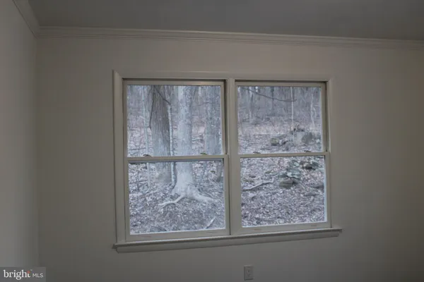 a view of a porch with a floor to ceiling window