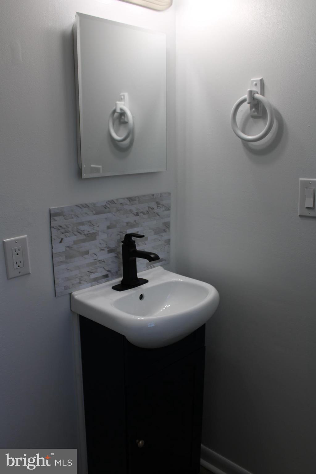 28 Henry Way Linden, VA 22642 - Photo 46 of 85 a bathroom with a sink and a mirror