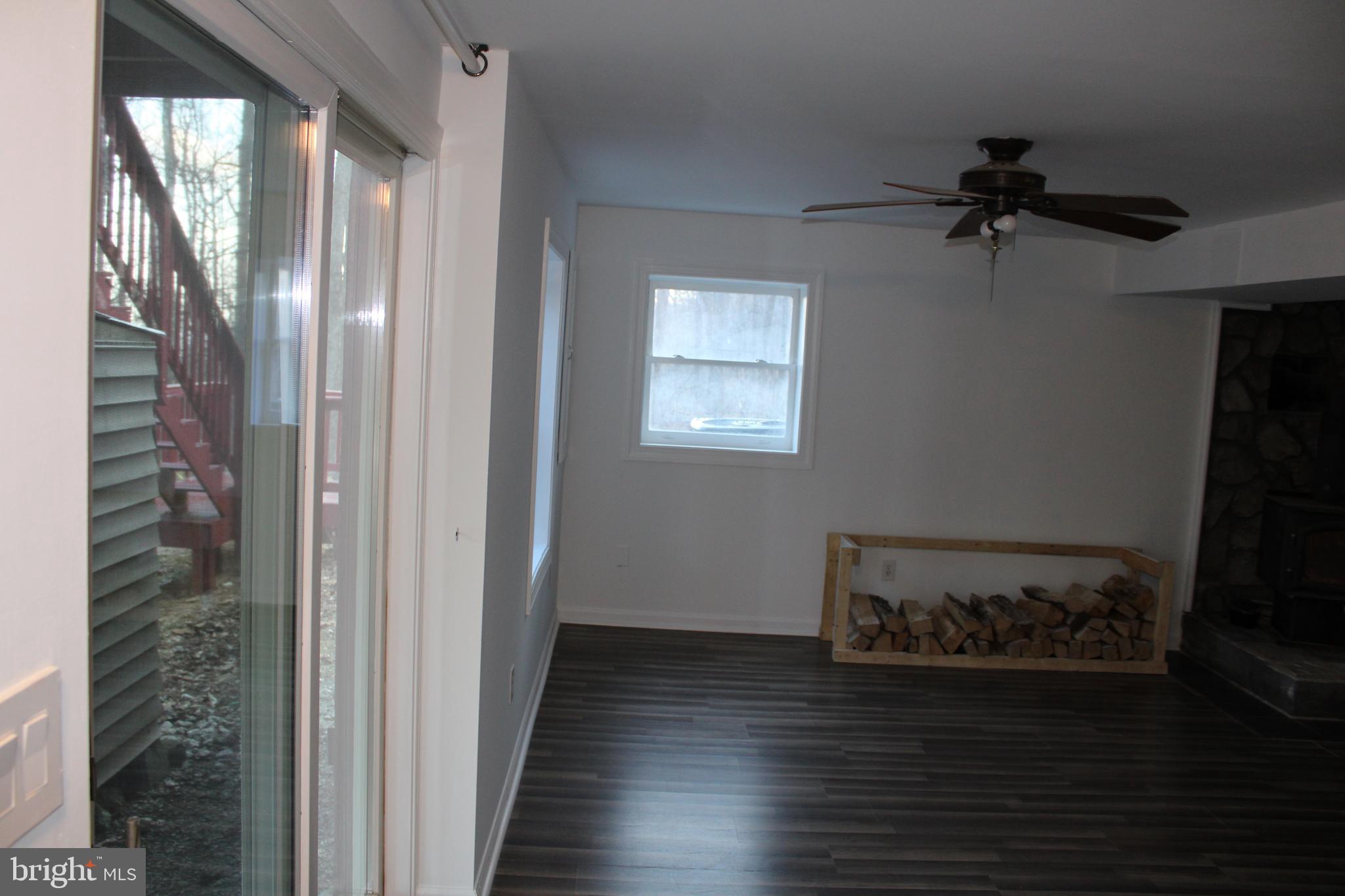 28 Henry Way Linden, VA 22642 - Photo 55 of 85 a view of a hallway to a livingroom with furniture