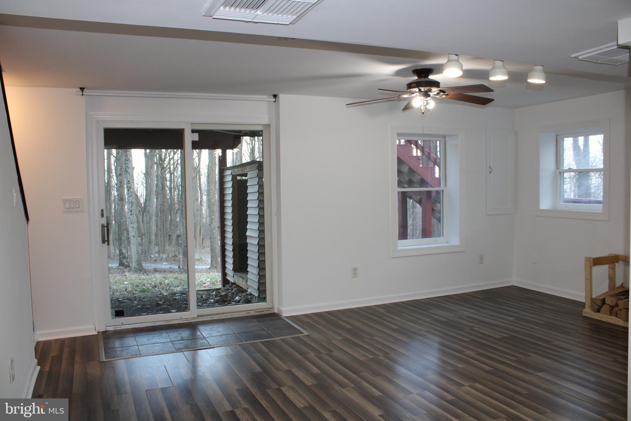 28 Henry Way Linden, VA 22642 - Photo 60 of 85 a view of an empty room with wooden floor and a window