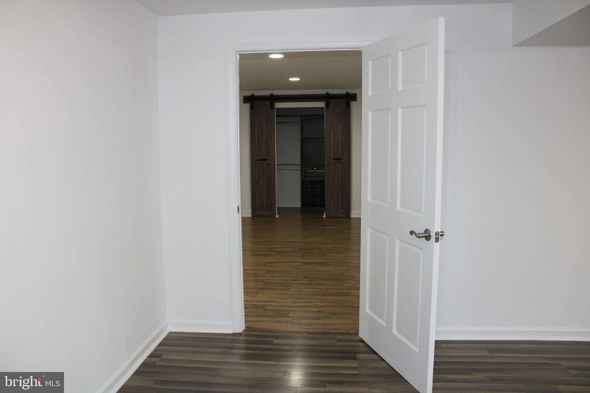 28 Henry Way Linden, VA 22642 - Photo 65 of 85 a view of a hallway with wooden floor and staircase