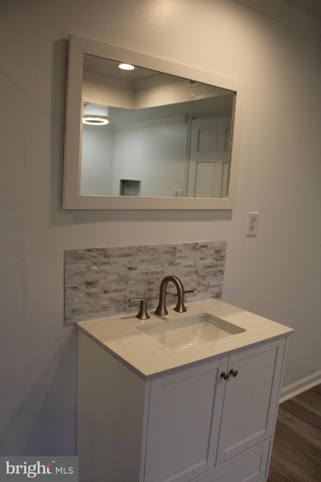 28 Henry Way Linden, VA 22642 - Photo 71 of 85 a bathroom with a sink and a mirror