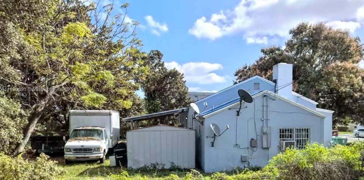 1391 Northwest 55th Terrace Miami, FL 33142 - Photo 4 of 5 a front view of a house with garden