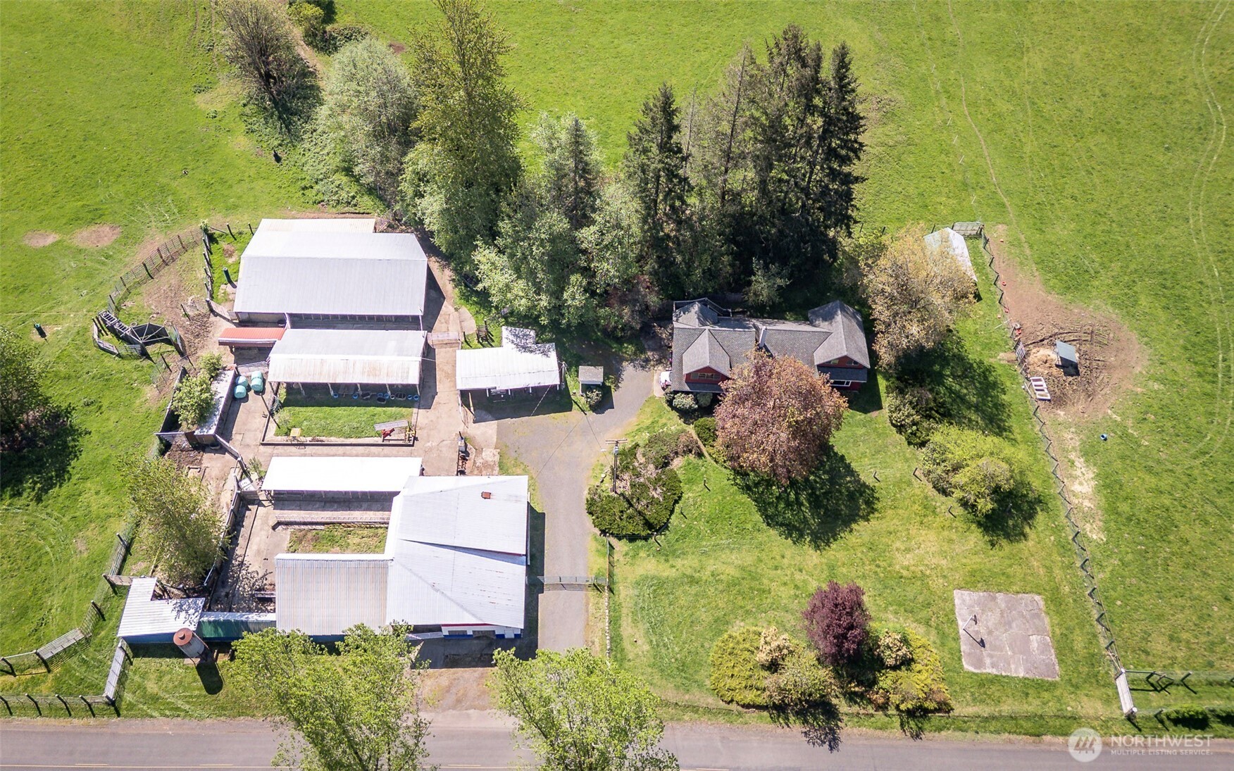 296 Dodge Road Morton, WA 98356 - Photo 7 of 24 an aerial view of a house with a garden and lake view