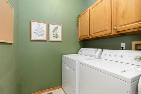 a bedroom with a large bed and a large window