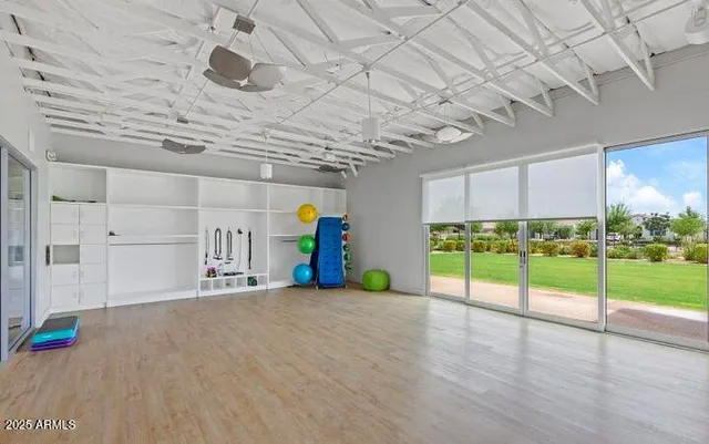 a view of a swimming pool with a garden and plants
