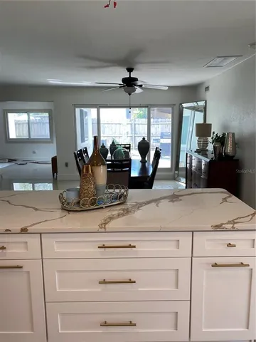 a view of a counter top the center island in the living room