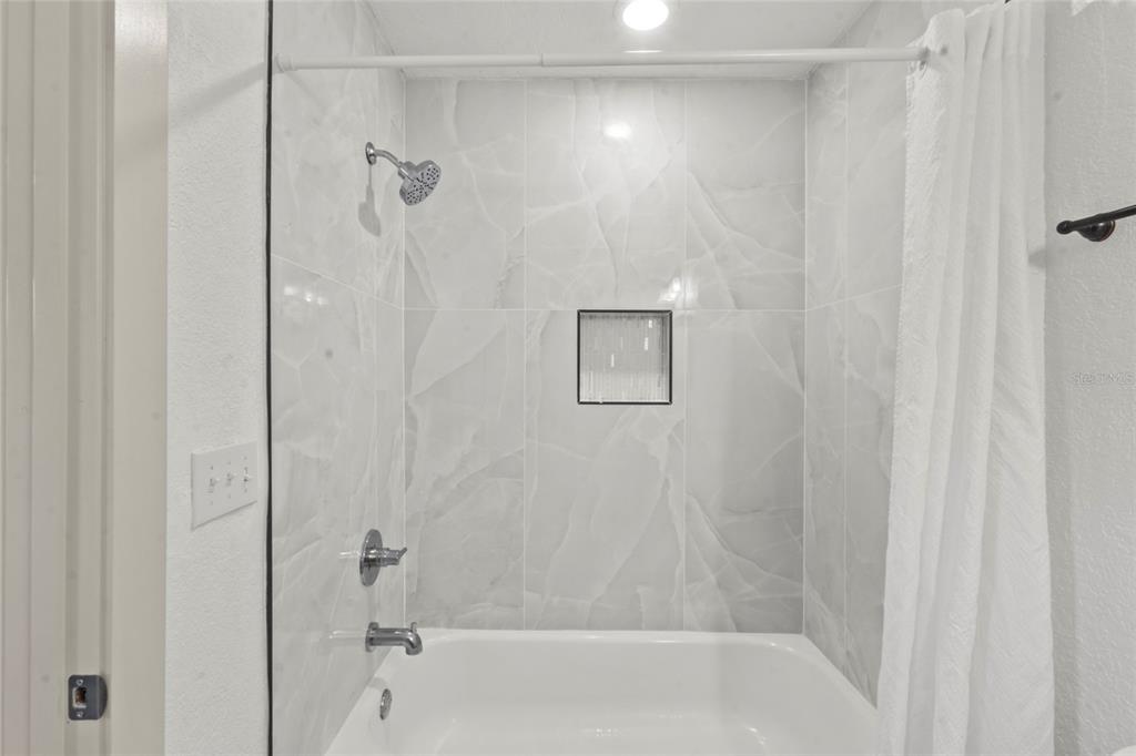 7230 Shepherd Street Sarasota, FL 34243 - Photo 17 of 30 a bathroom with a shower