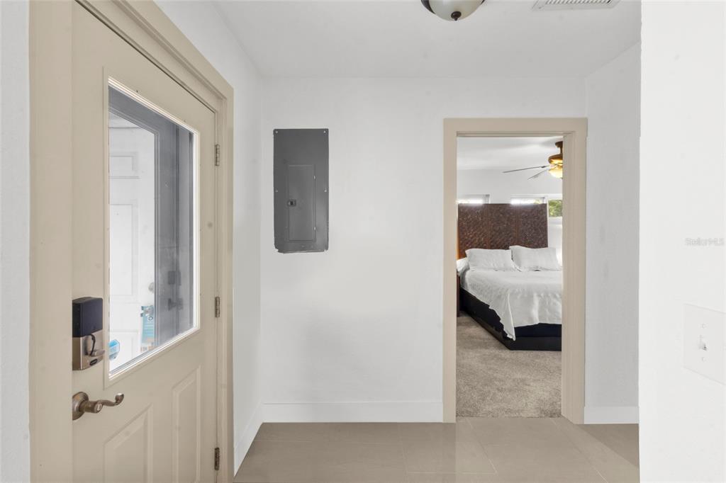 7230 Shepherd Street Sarasota, FL 34243 - Photo 18 of 30 a view of a bedroom from a hallway