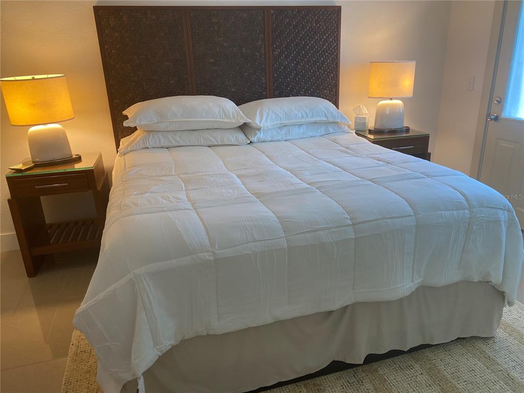 7230 Shepherd Street Sarasota, FL 34243 - Photo 19 of 38 a bedroom with a bed and window in it