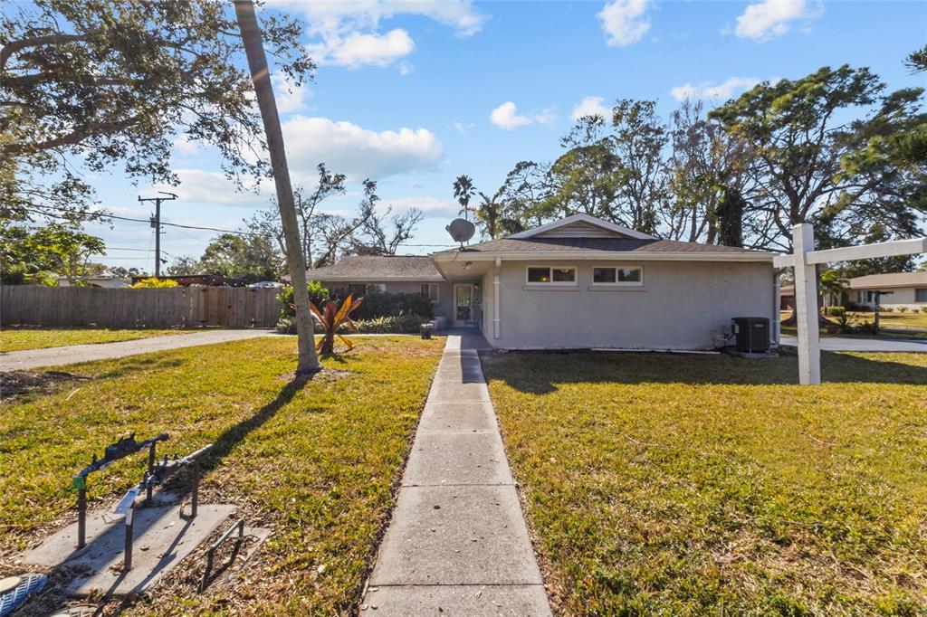 7230 Shepherd Street Sarasota, FL 34243 - Photo 2 of 30 a view of a swimming pool with an outdoor space and seating area
