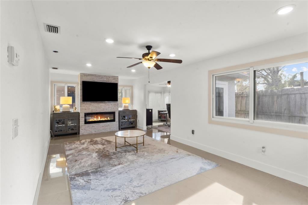 7230 Shepherd Street Sarasota, FL 34243 - Photo 21 of 30 a living room with furniture and a flat screen tv