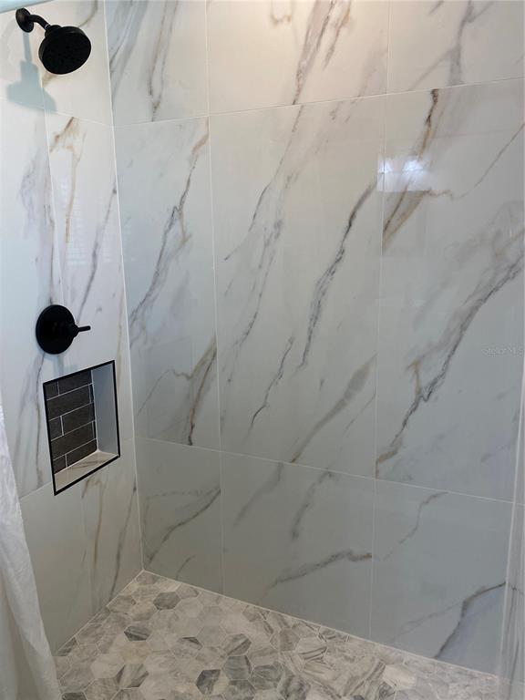 7230 Shepherd Street Sarasota, FL 34243 - Photo 22 of 38 a bathroom with a shower