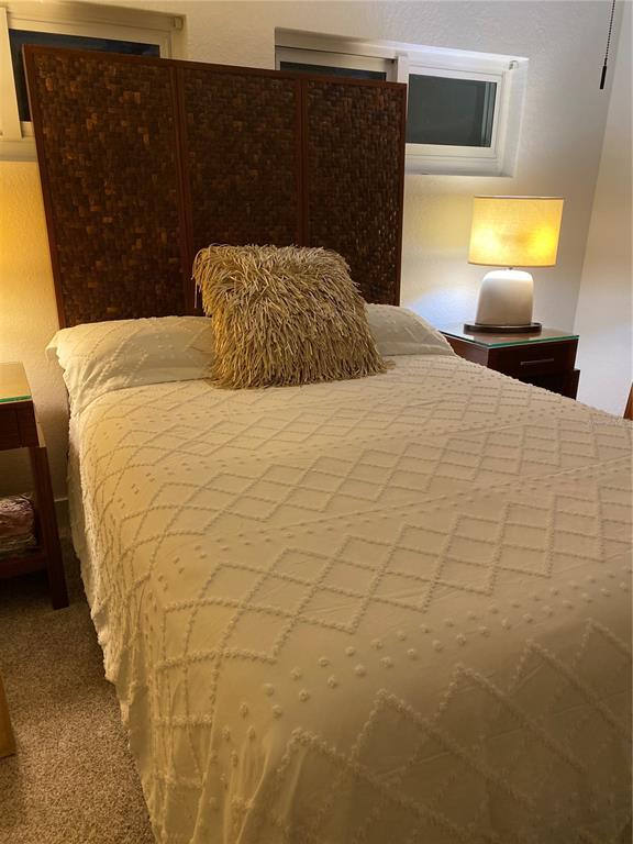 7230 Shepherd Street Sarasota, FL 34243 - Photo 24 of 38 a bedroom with a bed and a night stand